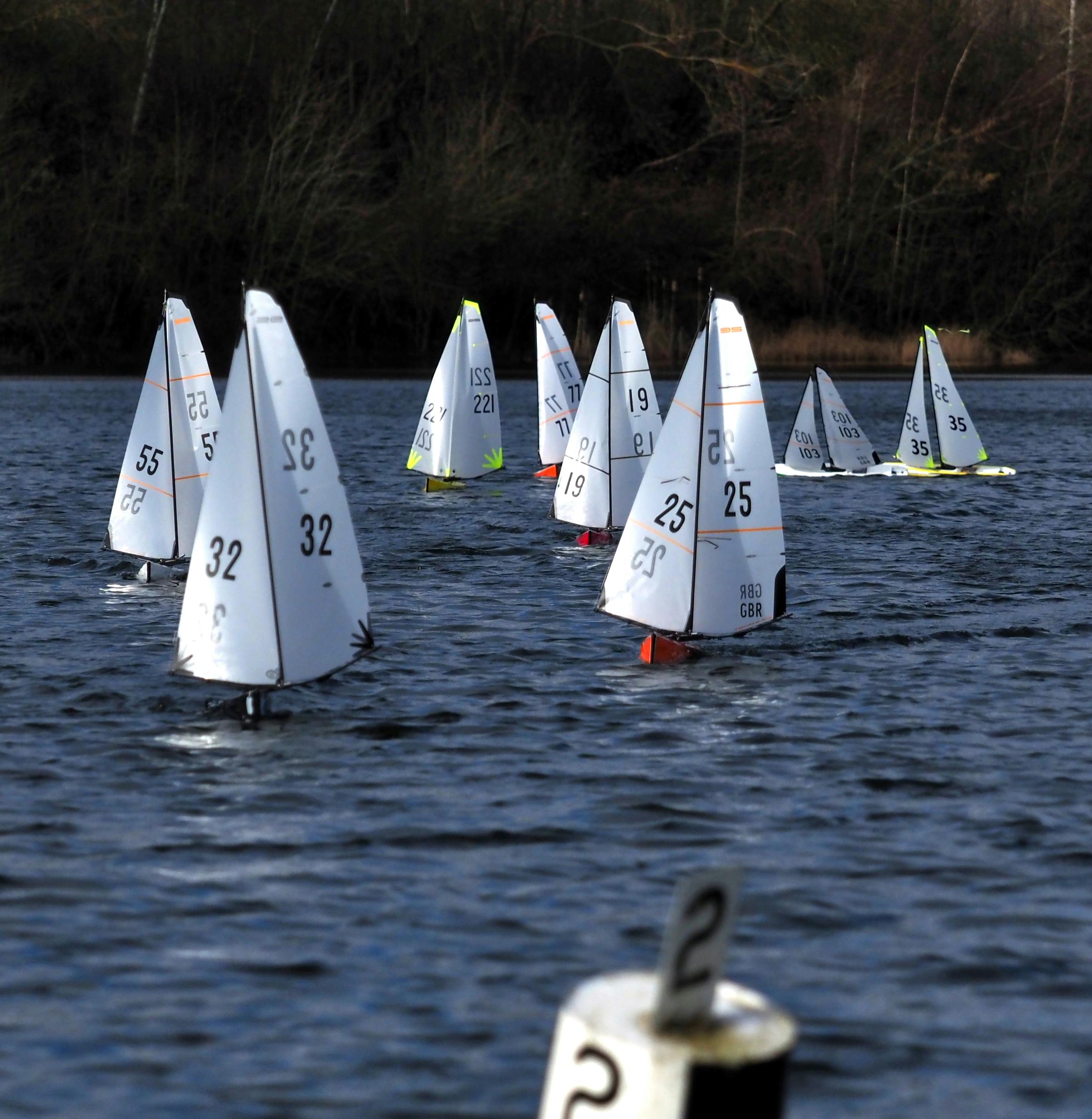 Free Model yachts sailing competitively on a pond in Pontefract, showcasing skilled recreation. Stock Photo