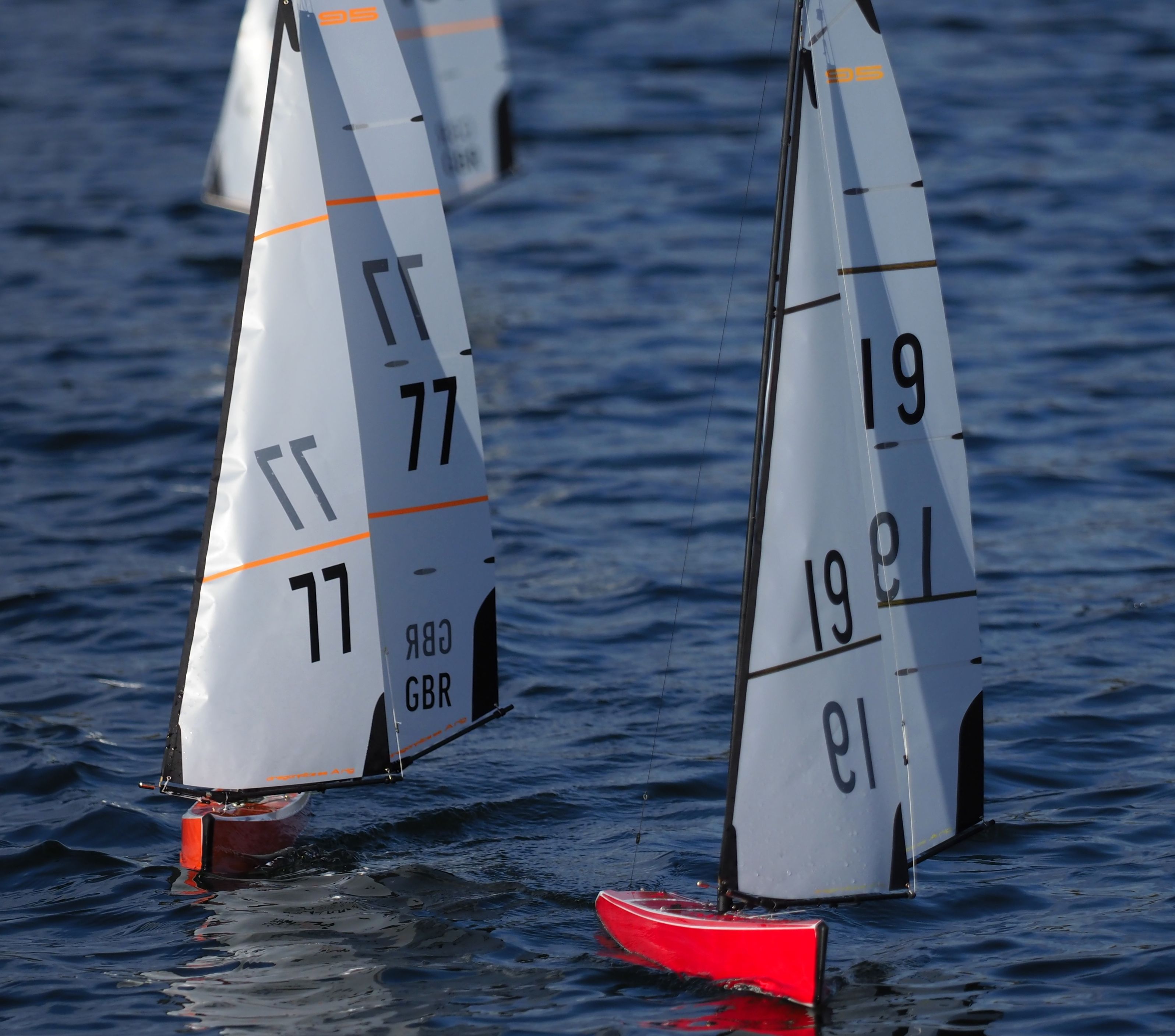 Close-up shot of model sailboats competing on water in Pontefract, England.