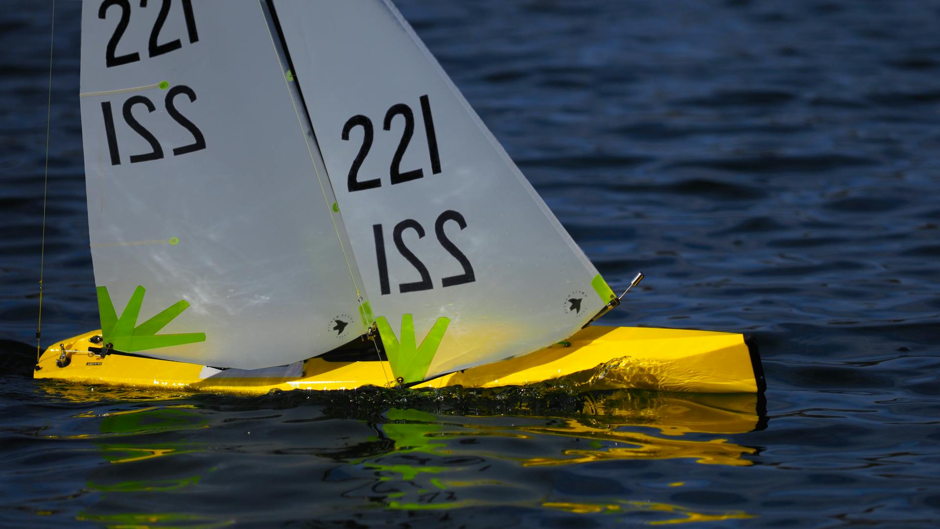 Close-up of a Model Yacht on a Body of Water