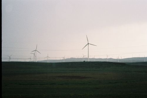 Free Scenic view of wind turbines on the rolling fields of Ulanqab, Inner Mongolia, China. Stock Photo