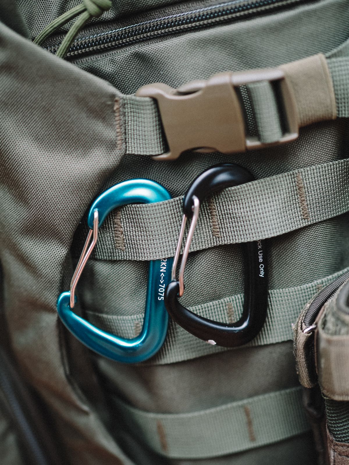 Aluminum utility carabiners attached to an outdoor backpack