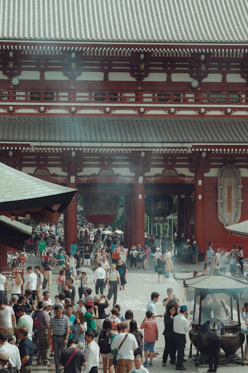 Crowd of Asian People by a Big Buddhist Traditional Temple