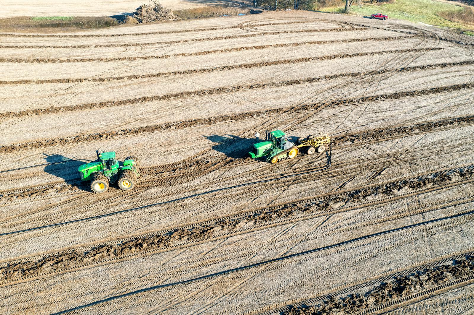 Man Riding Red Tractor On Field · Free Stock Photo
