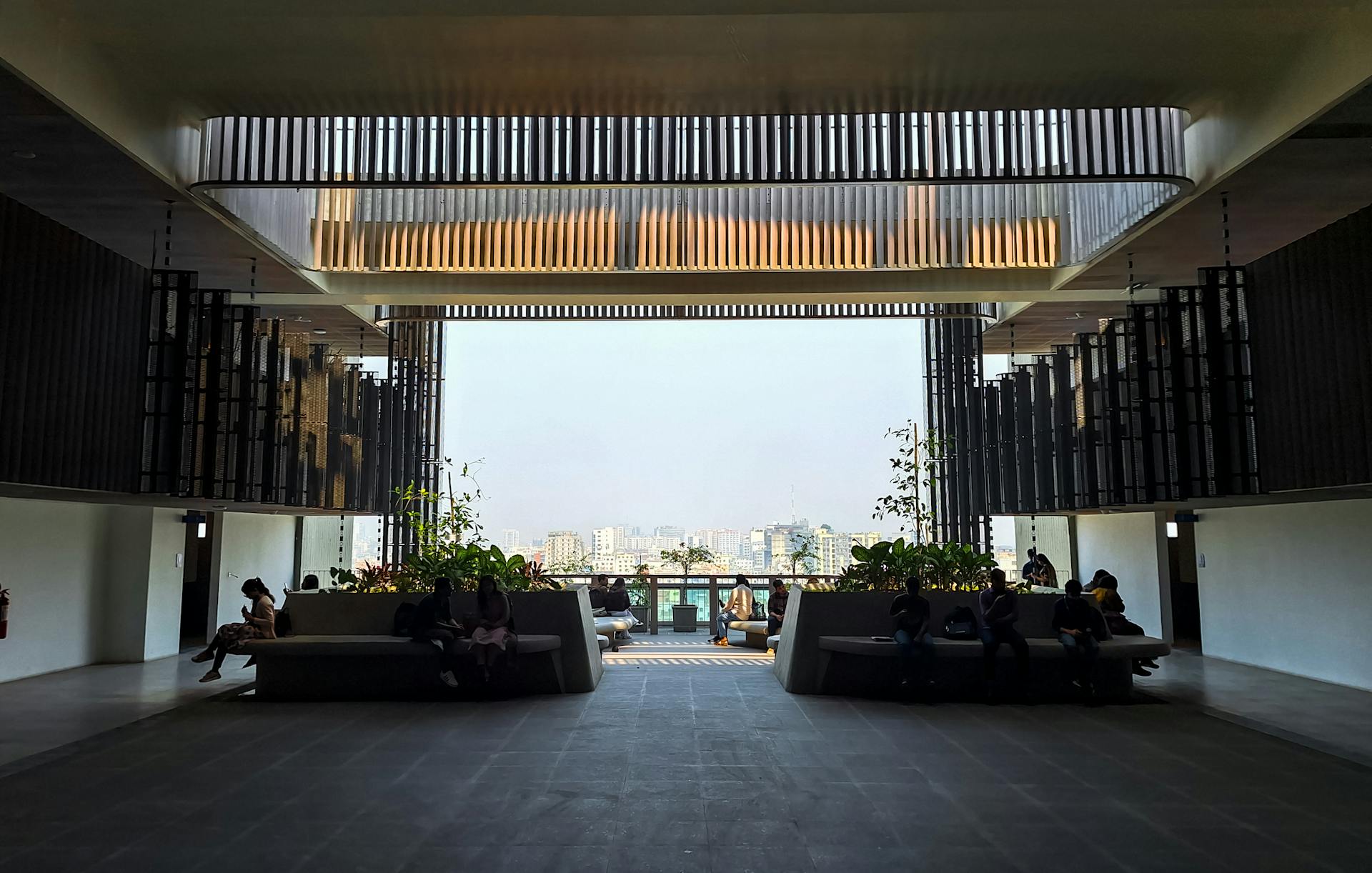 People Sitting on Benches at BRAC University in Bangladesh