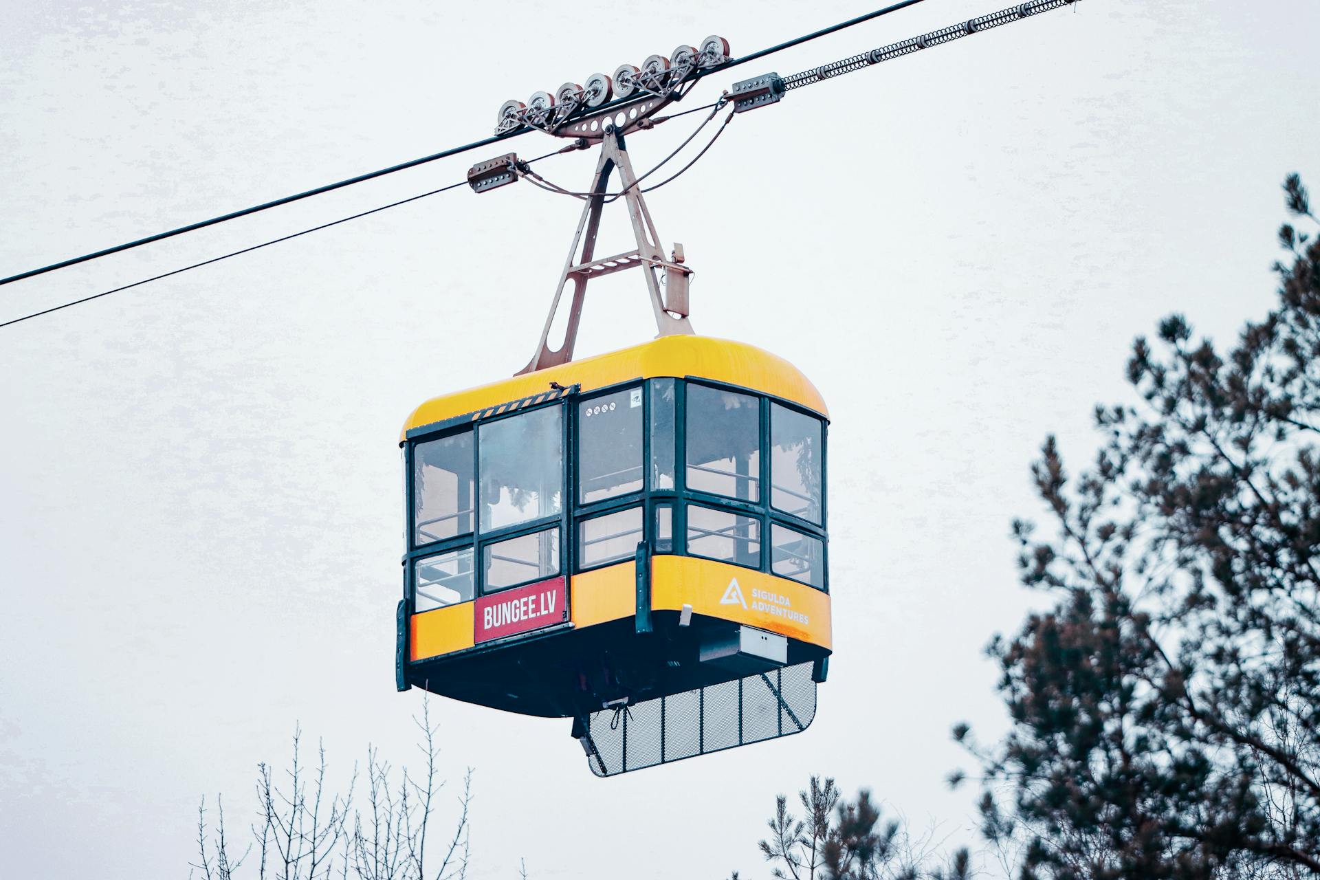 A vibrant cable car in Sigulda, Latvia, perfect for adventure sports enthusiasts.