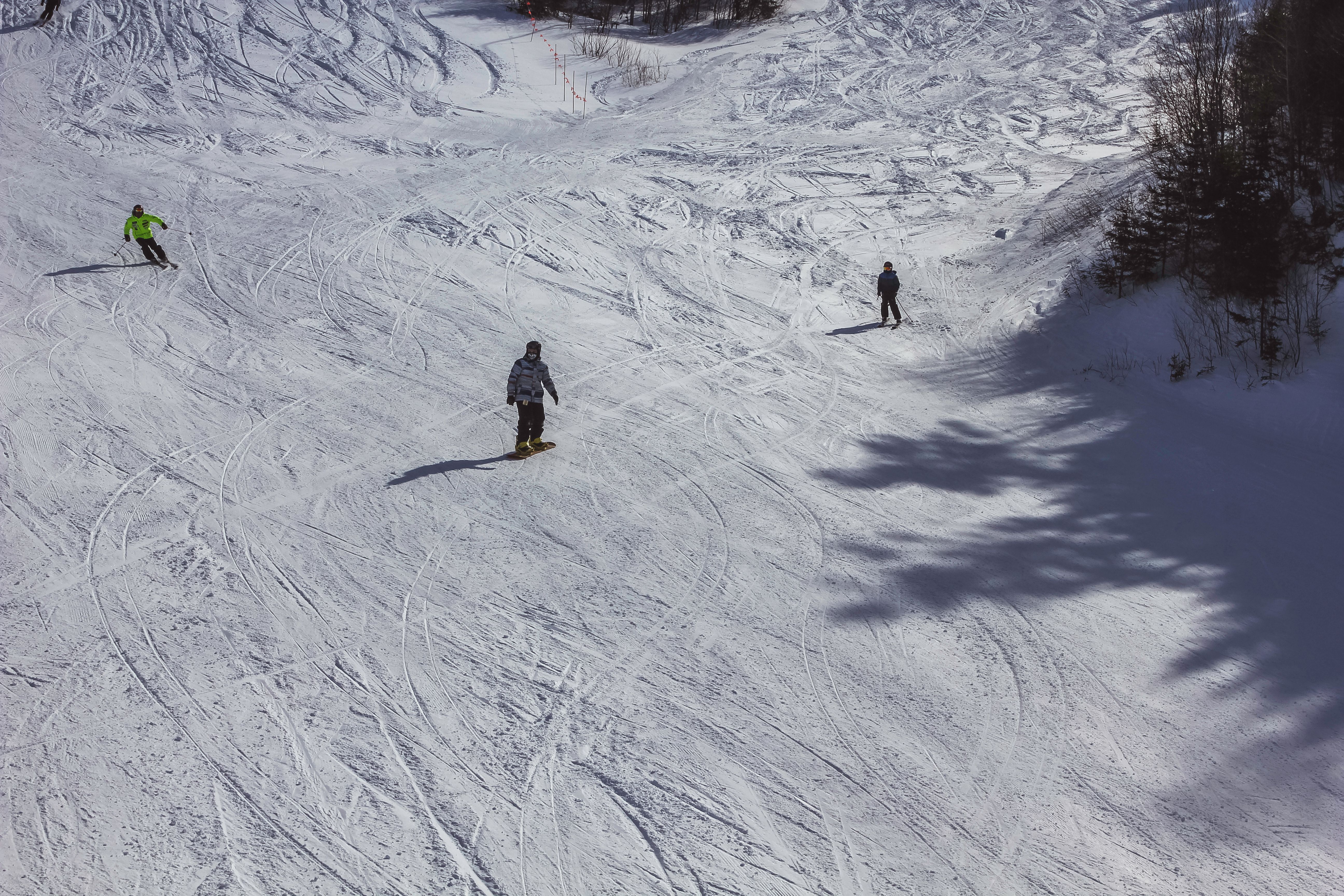 Capture of skiers descending the snowy slopes at Mont-Tremblant, Canada. Winter sports adventure.