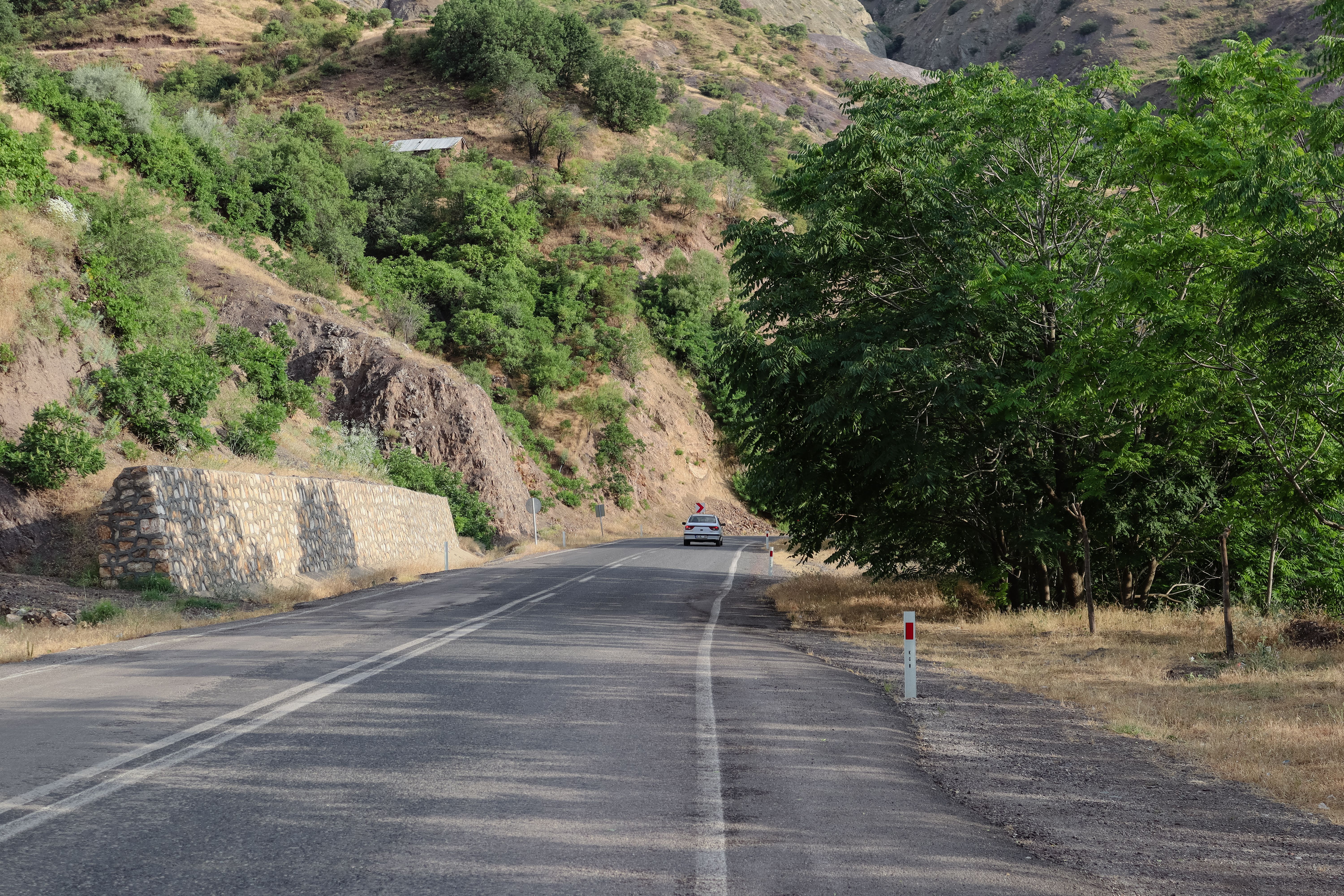 Well-maintained M4 highway in Armenia leading towards Lake Sevan with scenic mountain views