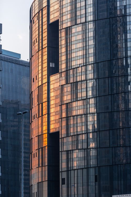 Free Glassy skyscrapers in Dubai reflecting sunset hues, exemplifying modern urban architecture. Stock Photo