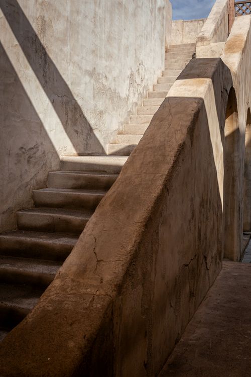 Free A weathered stone staircase in an urban environment highlighting architectural details. Stock Photo