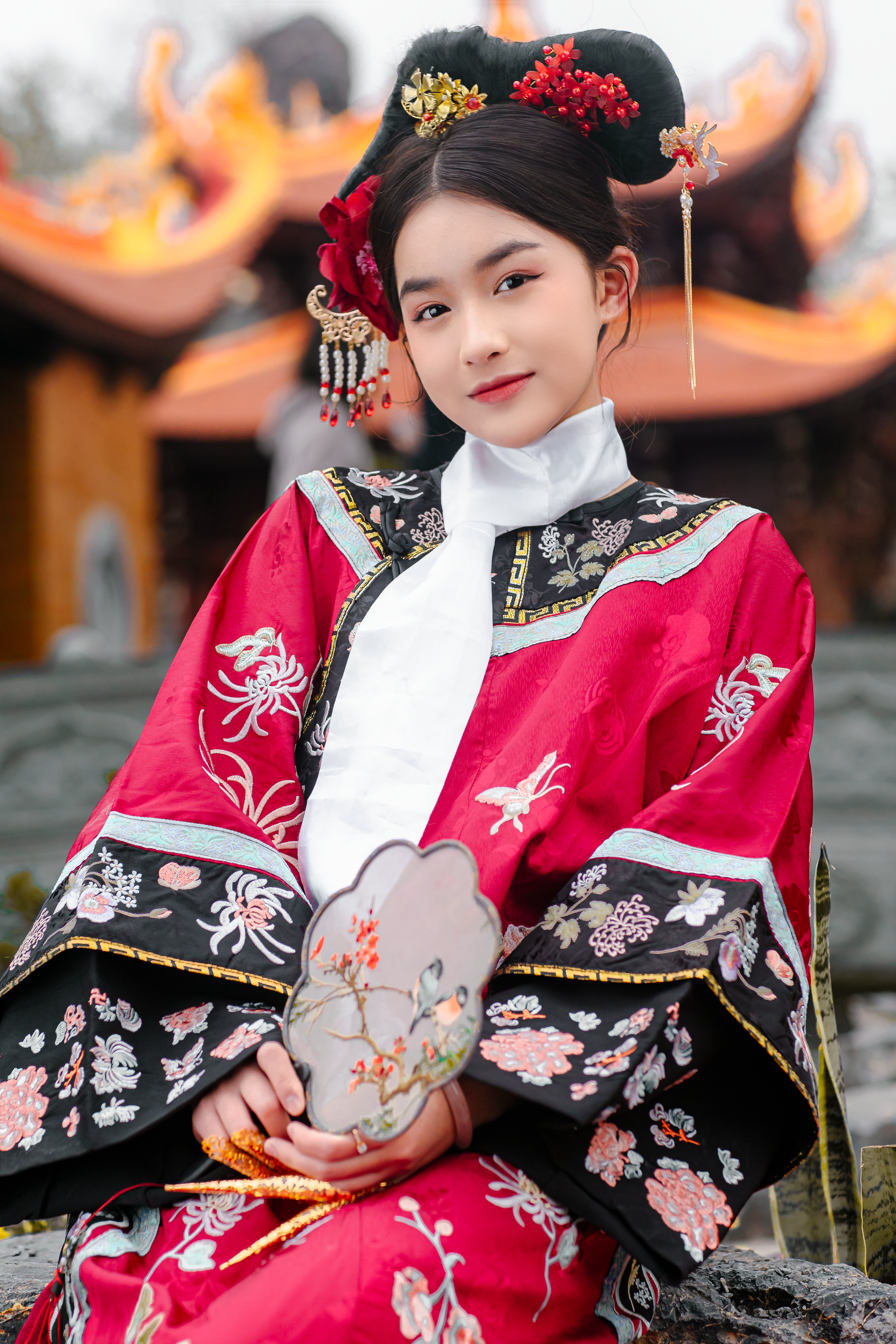 A woman in traditional chinese clothing posing for a photo · Free Stock ...