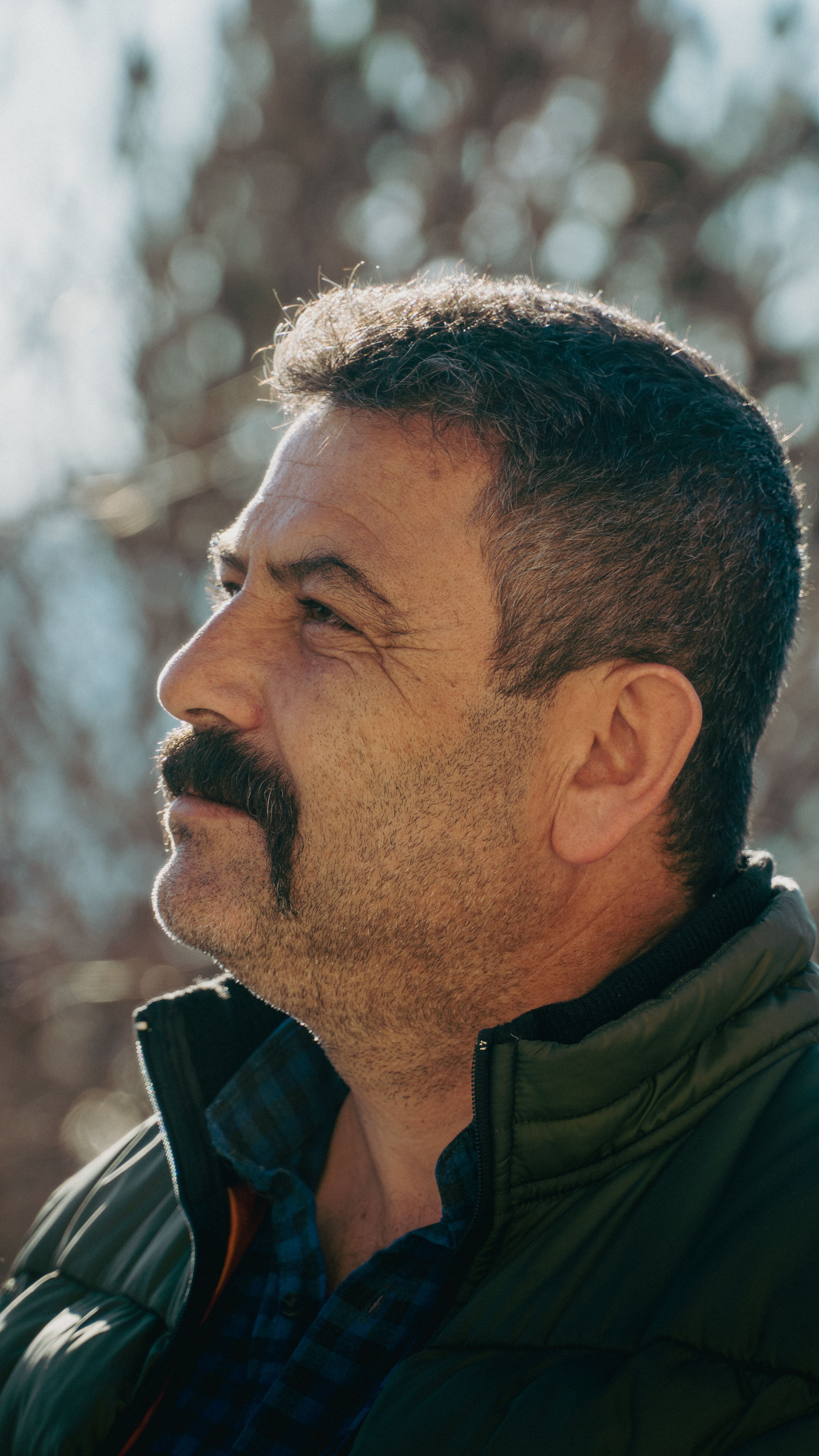 Portrait of a middle-aged man with a mustache in Niğde, Türkiye, captured in natural light.