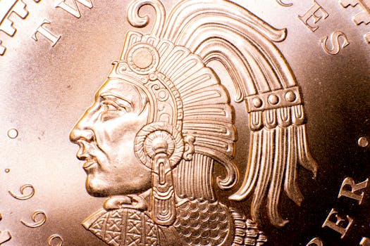 Detailed close-up of an Aztec-inspired design engraved on a copper coin, highlighting intricate artistry.