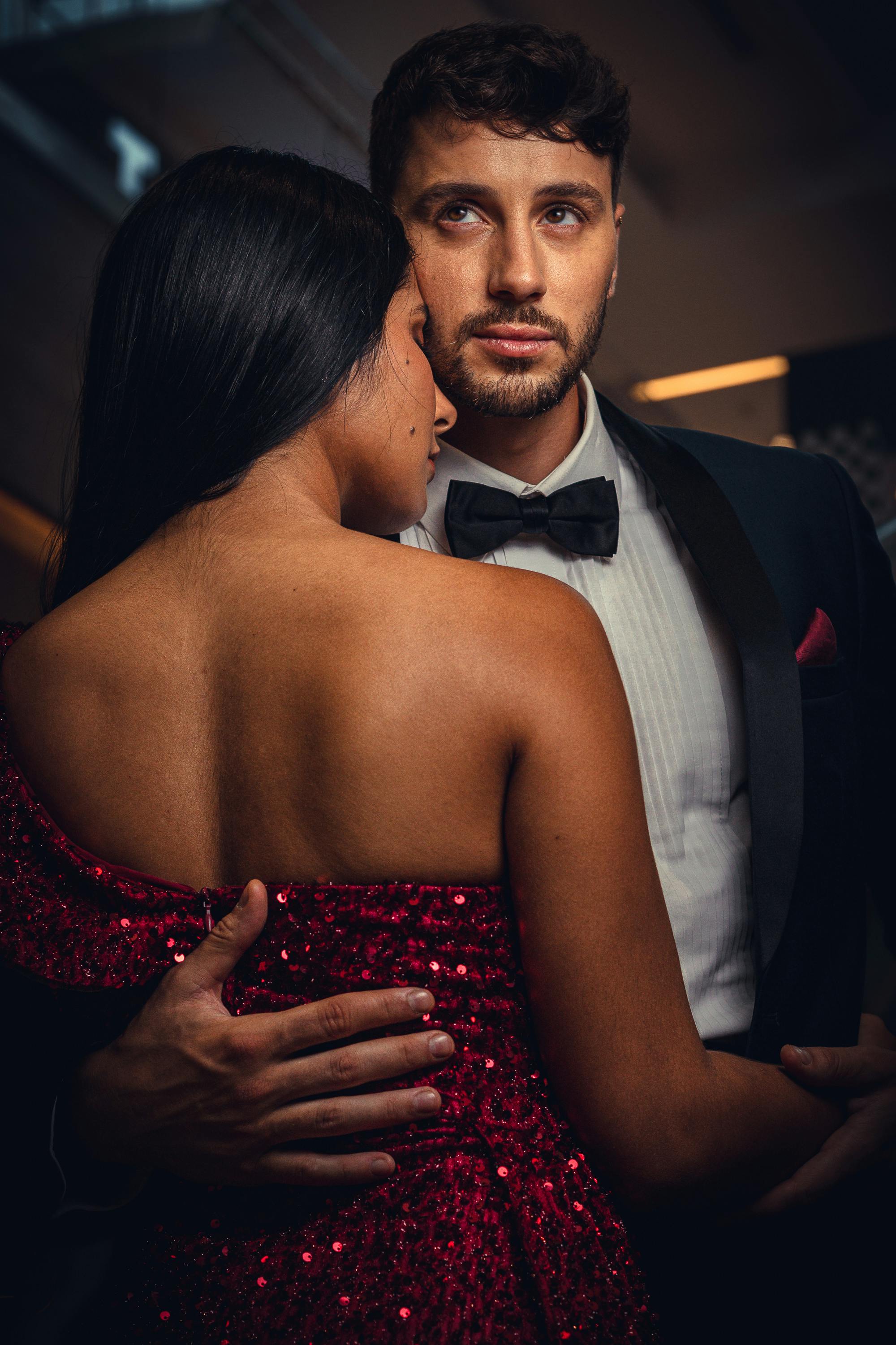 Man in a Tuxedo Dancing with His Girlfriend Wearing Red Sequin Dress · Free  Stock Photo