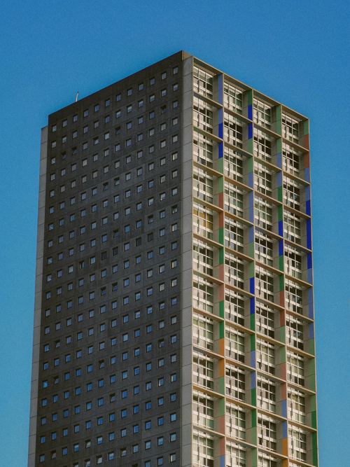 Free Tall skyscraper with colorful facade in Tilburg, Netherlands - urban architecture. Stock Photo