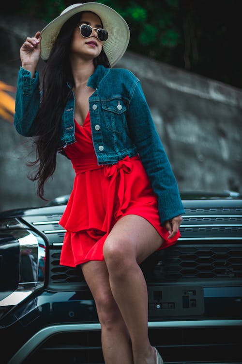 Model in Red Dress and Denim Jacket