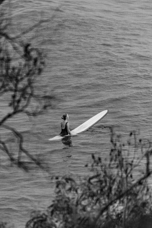 Woman on Surfboard in Black and White