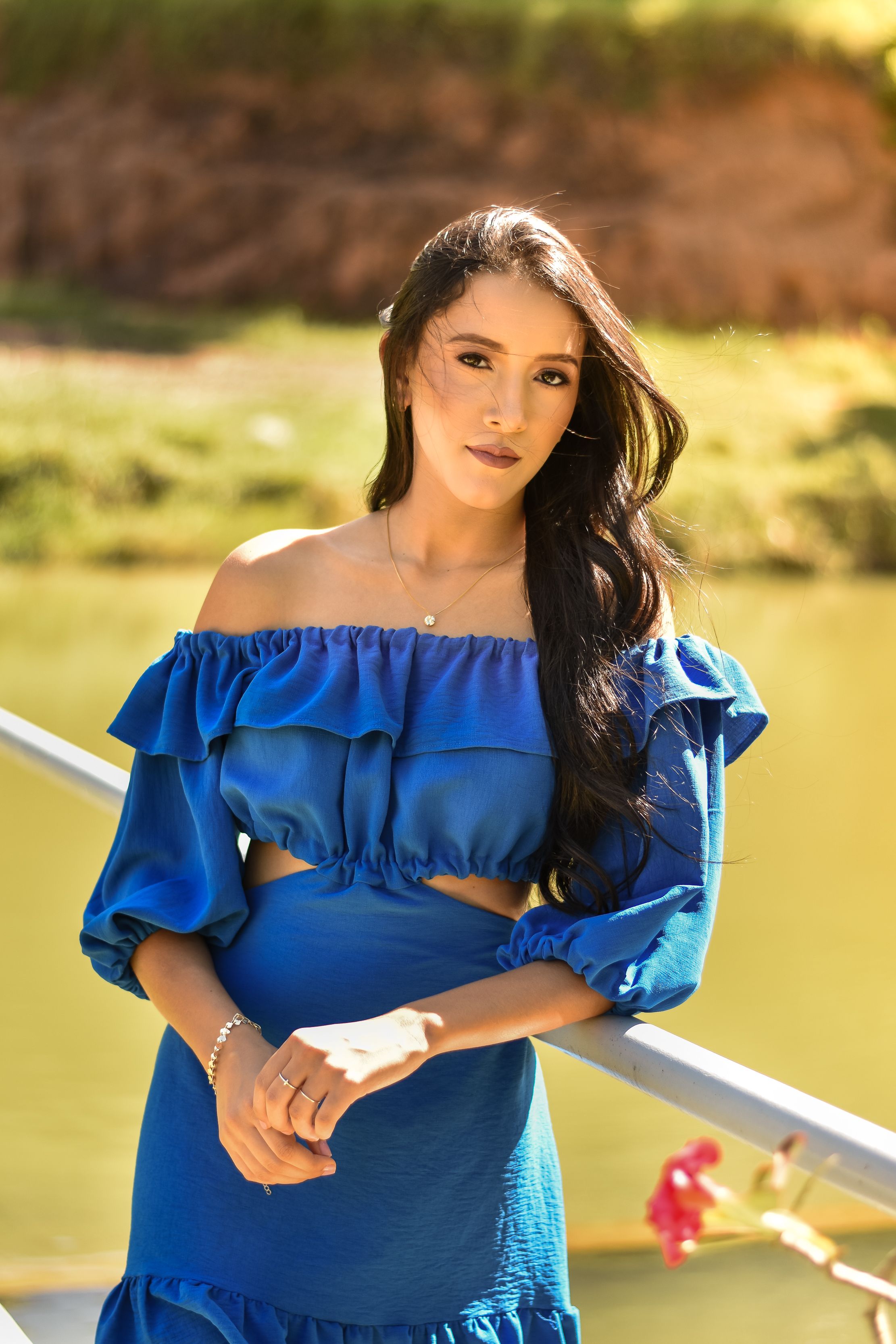 A woman in blue dress posing for the camera · Free Stock Photo