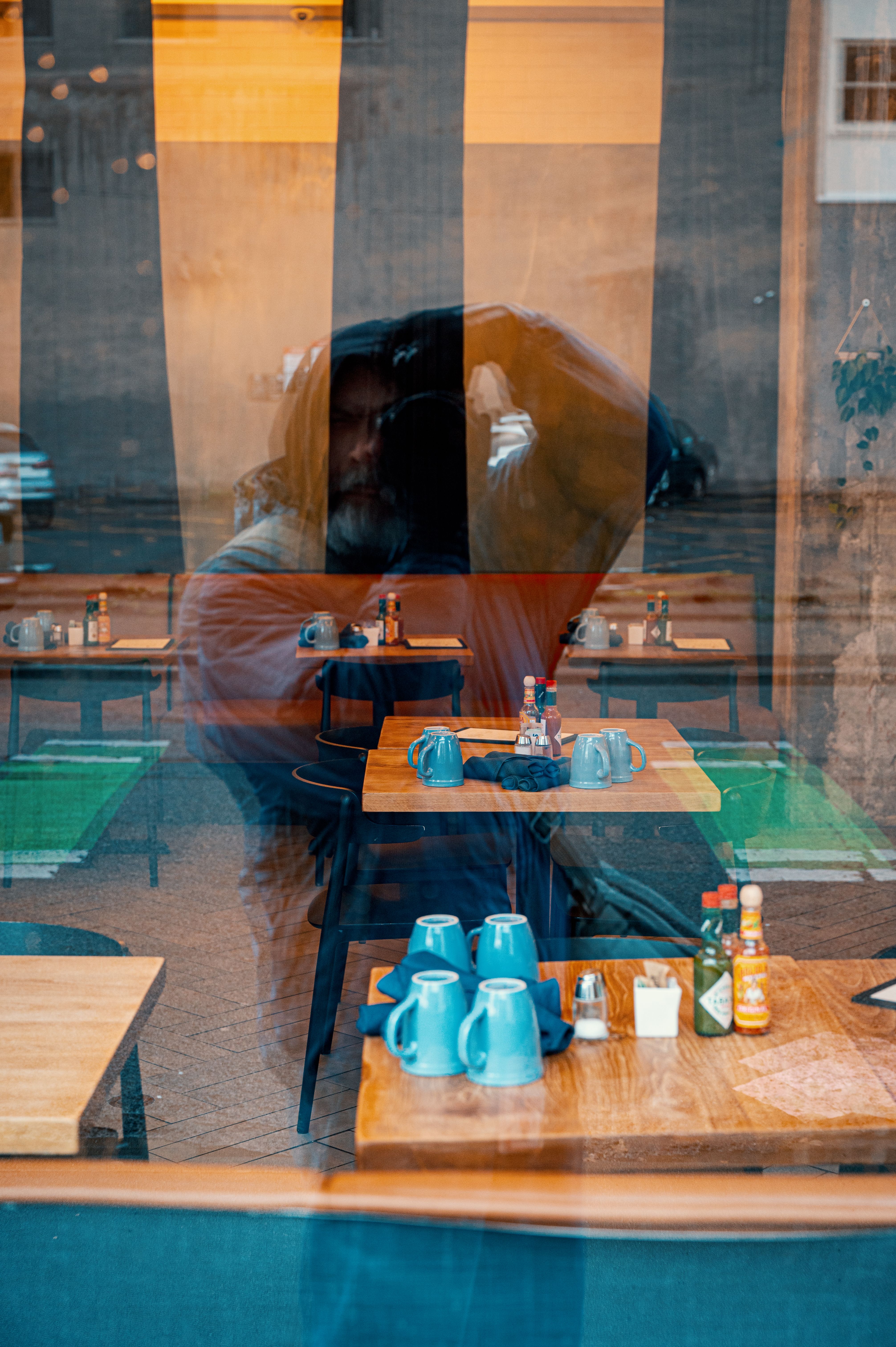 Reflection of Man Taking Pictures in Window · Free Stock Photo