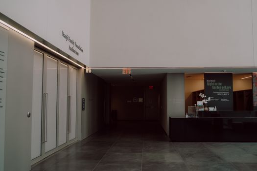 The lobby of a building with a black counter