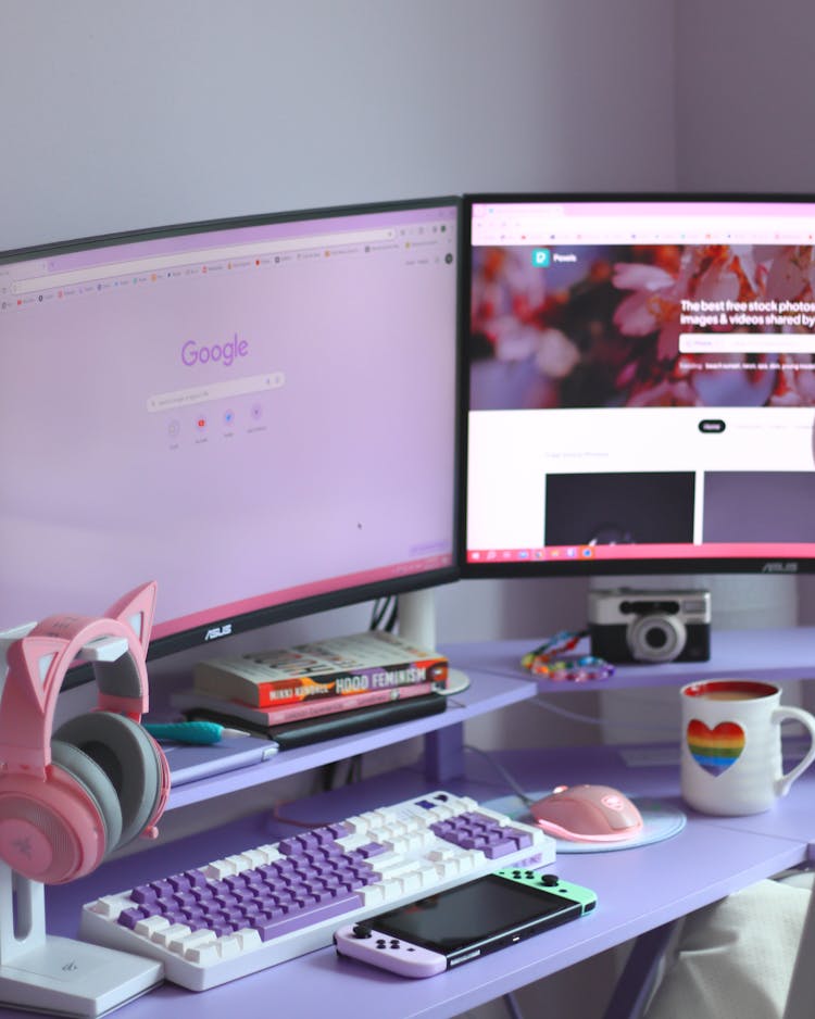 Monitors And Electronics On Desk