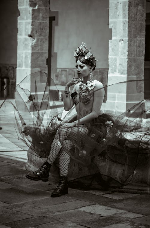 Dancer Sitting on a Fountain