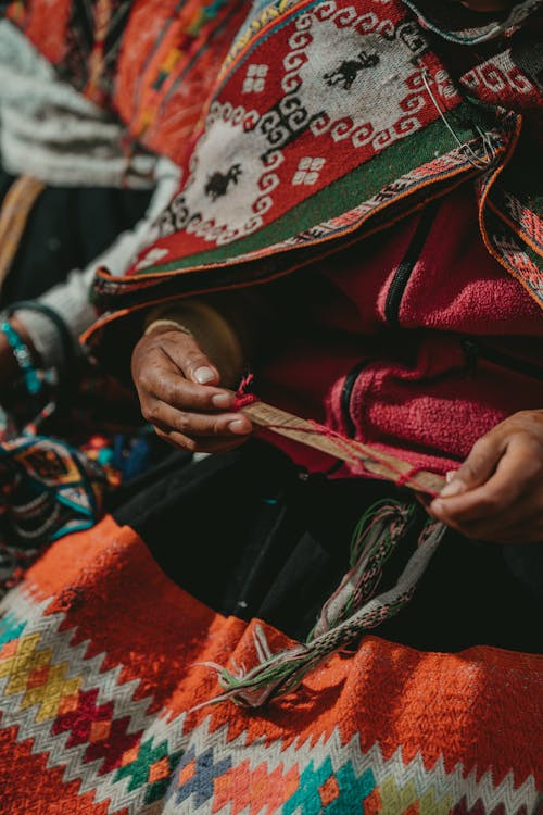 Closeup of Women Wearing Traditional Woven Clothing