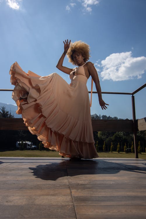 Model in a Pink Dress Posing on the Terrace