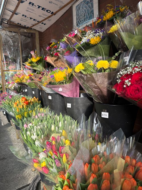 A flower shop with many different types of flowers