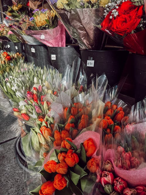 Bouquets of Flowers Displayed on the Sidewalk