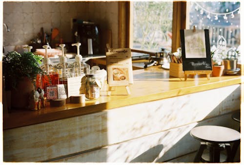 A counter with a coffee pot and a few other items