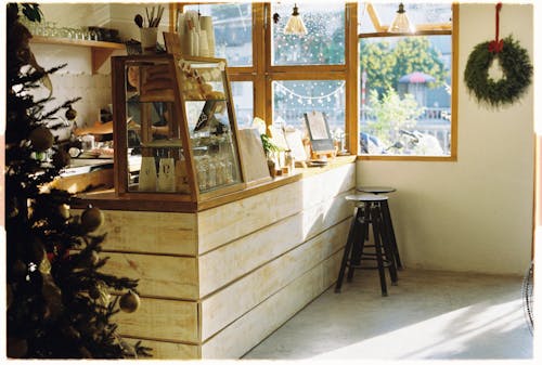 A small room with a counter and a christmas tree