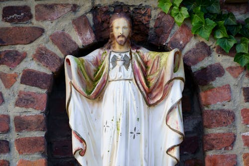 Jesus Christ Figurine by Wall