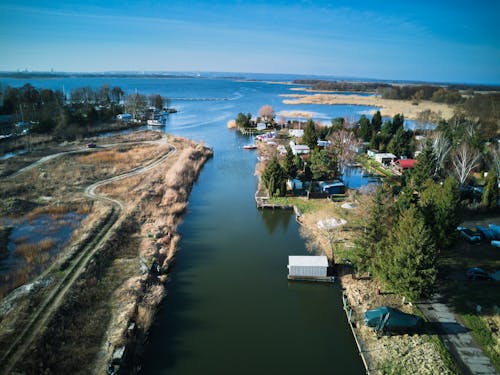 aerial view of lake and small marina during early spring