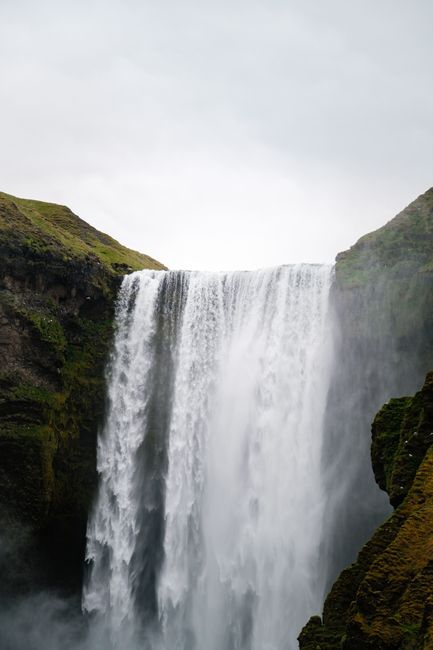 Breathtaking view of Skogafoss waterfall cascading in Iceland's stunning nature.