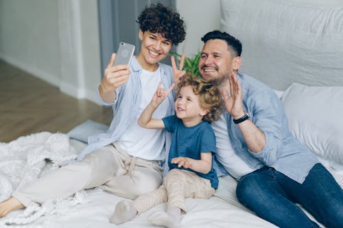 Man, Woman and Their Little Son Taking a Selfie 