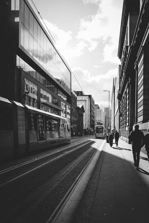 Black and white photo of people walking on the street