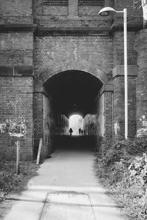 A black and white photo of a tunnel