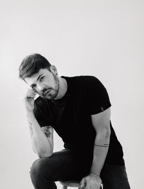 Free Black and white portrait of a thoughtful man posing in a studio setting. Stock Photo