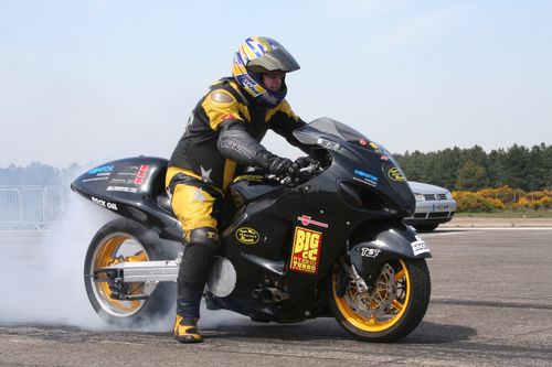 Free Motorcyclist performing an exciting burnout stunt on track at Woodbridge, capturing speed and adrenaline. Stock Photo