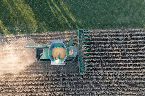 Aerial view of a combine harvesting a field