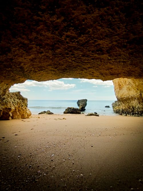 Free A tranquil view of the sea from inside a coastal cave, highlighting nature's beauty. Stock Photo