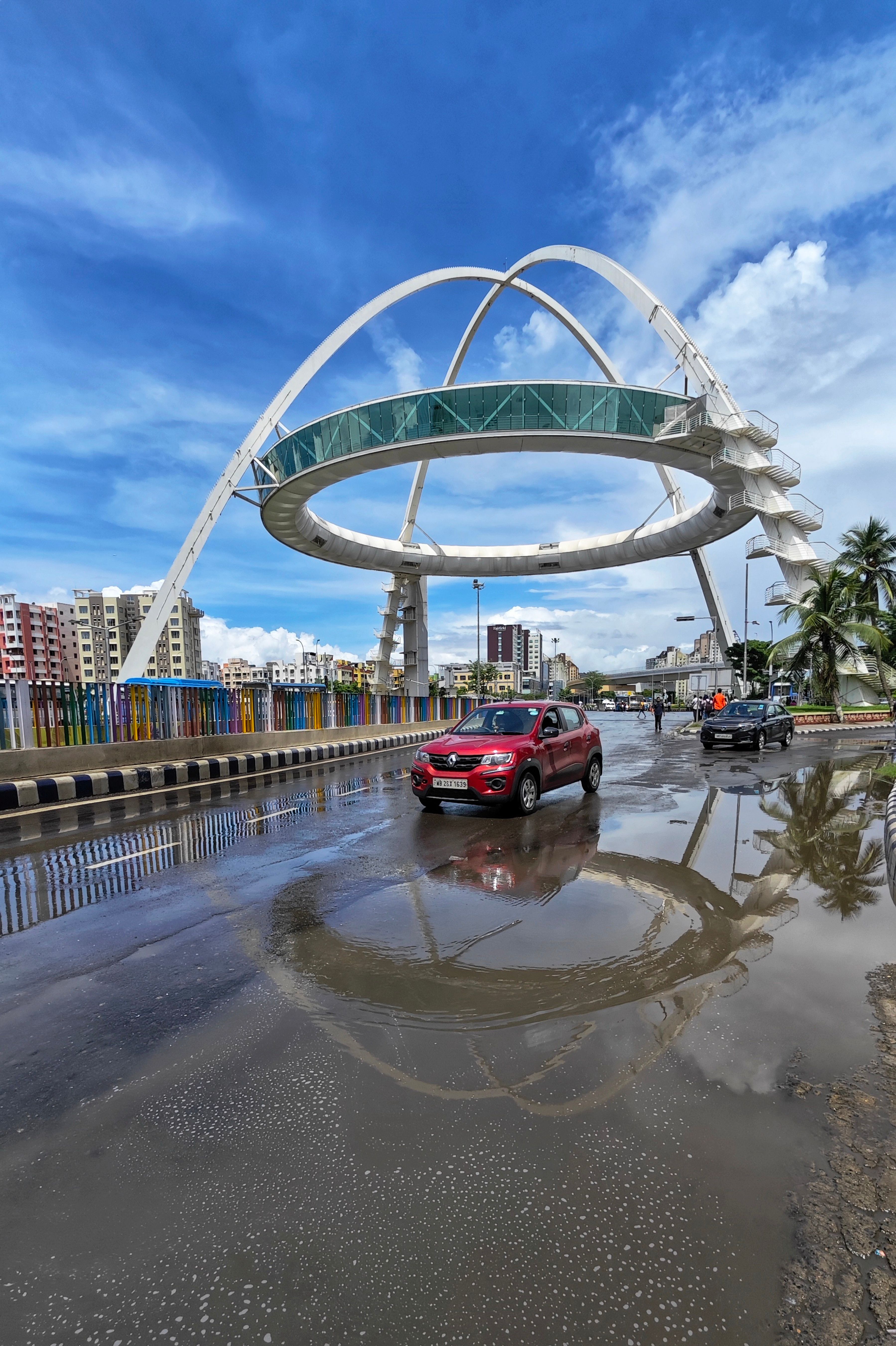 Cars Driving under a Biswa Bangla Gate in India · Free Stock Photo