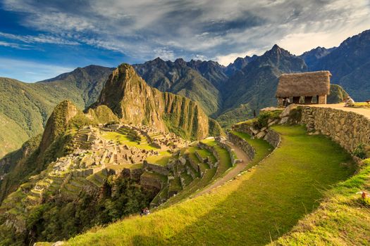 A breathtaking view of the ancient ruins of Machu Picchu with surrounding mountains.