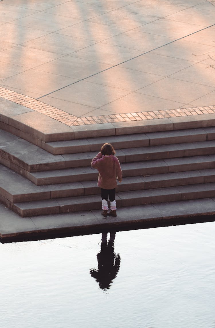 Girl Playing With Her Reflection