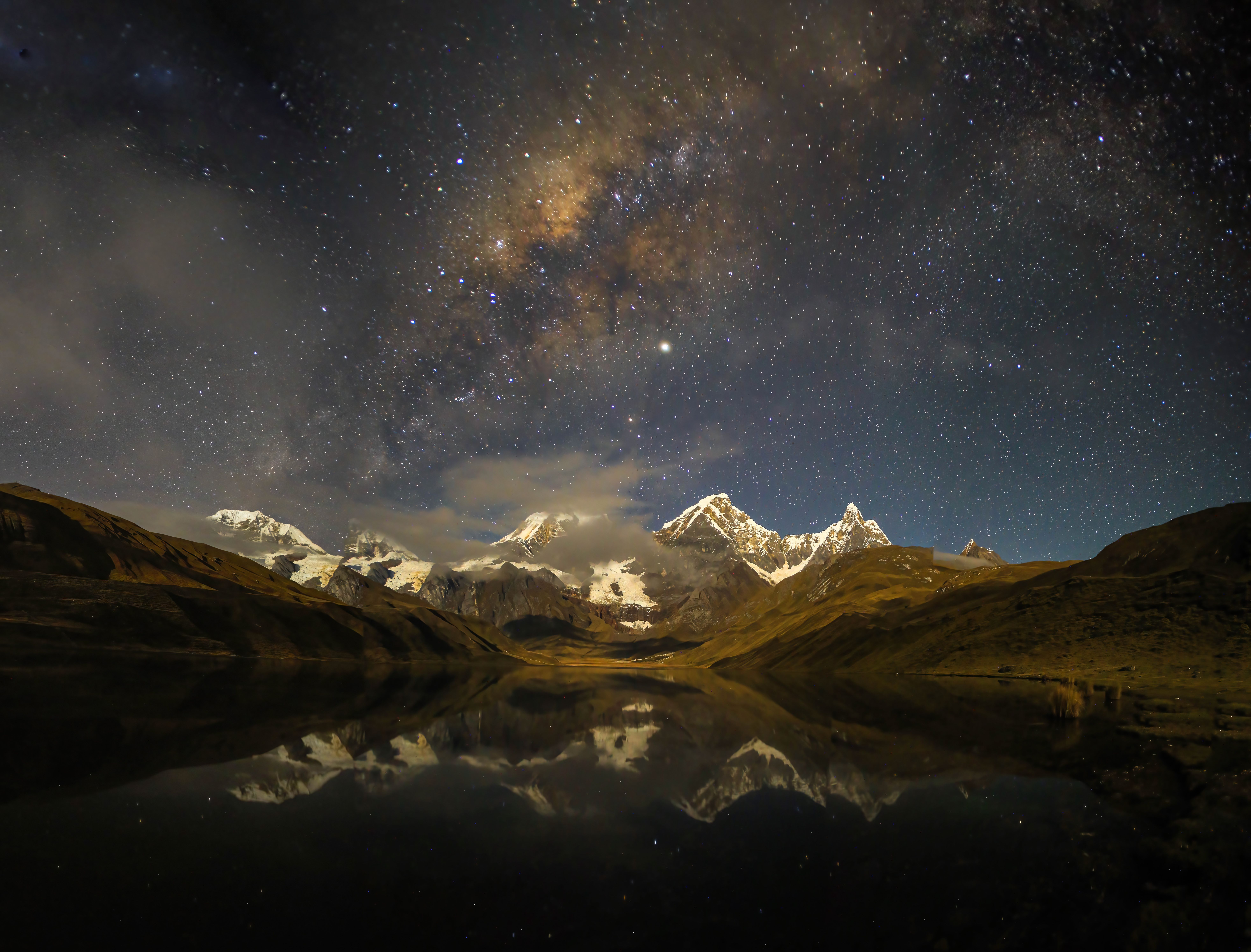 Starry evening sky resting peacefully over dark mountain contours