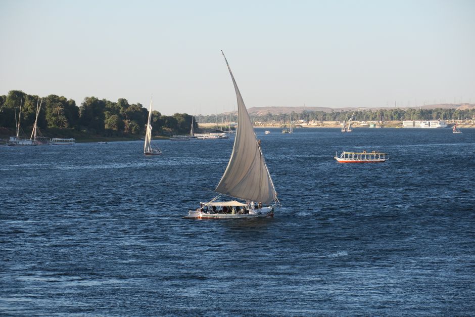 Traditional felucca boat sailing on the Nile River in Luxor, Egypt
