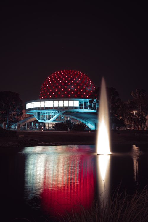Free Illuminated Galileo Galilei Planetarium in Buenos Aires with stunning night reflections. Stock Photo