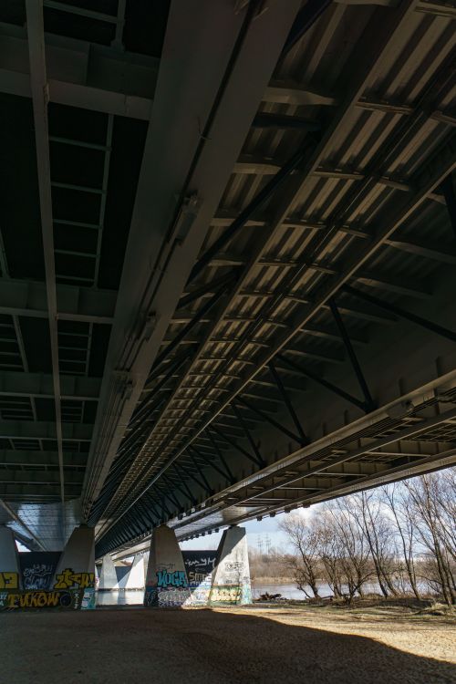 Free A unique perspective view of a modern bridge with graffiti art in Warsaw, Poland. Stock Photo