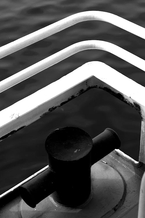 A black and white photo of a railing
