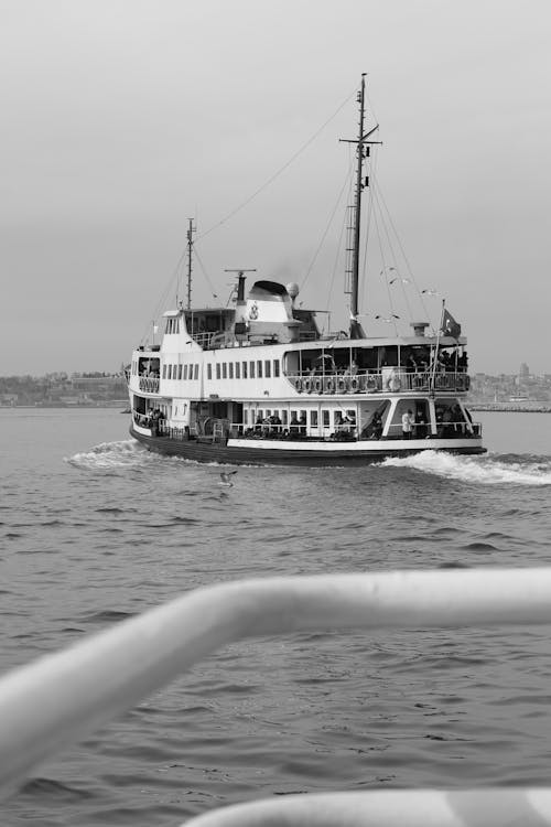 A ferry boat is traveling through the water